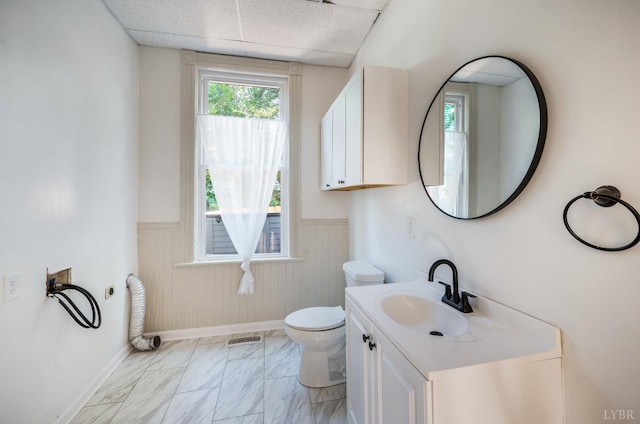 838 Rivermont Ave, Lynchburg, VA 24504 - bathroom with wainscoting, vanity, plenty of natural light, and marble finish flooring