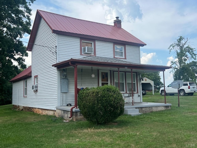 3200 Pocket Rd, Hurt, VA 24563 - view of front of home featuring covered porch, a metal roof, a front yard, a chimney, and cooling unit