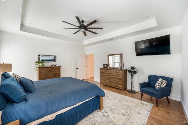 336 Somerset Dr, Appomattox, VA 24522 - bedroom featuring a tray ceiling, wood finished floors, and ceiling fan