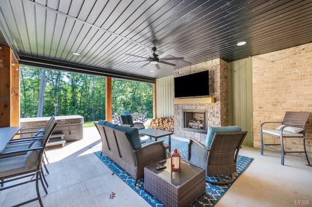 336 Somerset Dr, Appomattox, VA 24522 - view of patio / terrace with a hot tub, a ceiling fan, and an outdoor living space with a fireplace