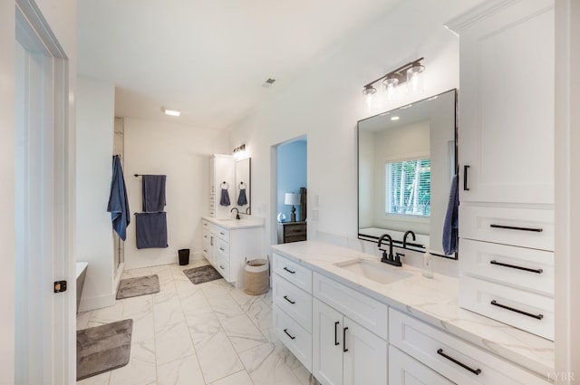 336 Somerset Dr, Appomattox, VA 24522 - bathroom with two vanities, marble look tiles, and a shower stall