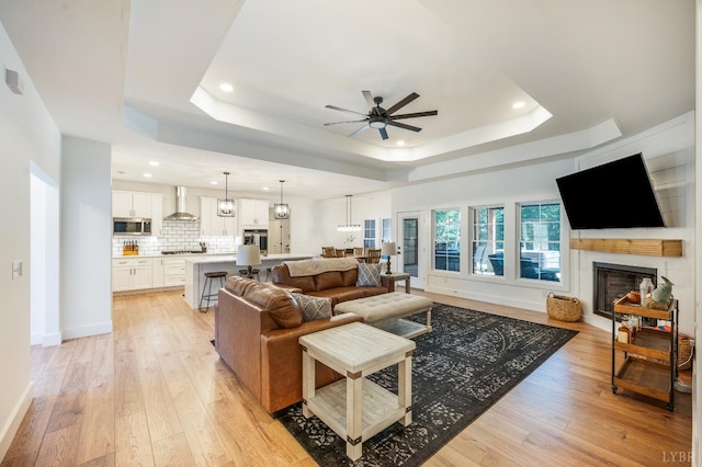 336 Somerset Dr, Appomattox, VA 24522 - living area with a raised ceiling, a ceiling fan, recessed lighting, light wood finished floors, and a fireplace