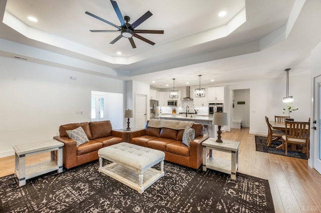 336 Somerset Dr, Appomattox, VA 24522 - living room featuring ceiling fan, recessed lighting, hardwood / wood-style floors, and a raised ceiling