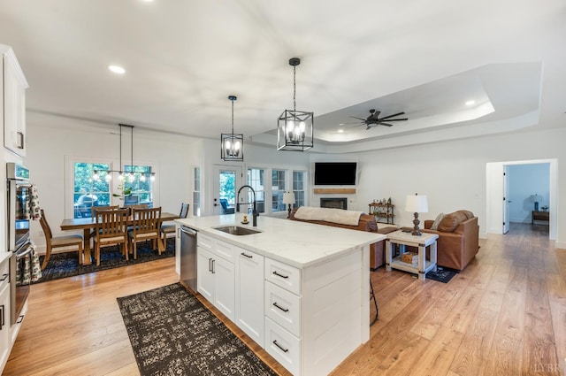 336 Somerset Dr, Appomattox, VA 24522 - kitchen with ceiling fan, light wood-type flooring, a fireplace, white cabinetry, and recessed lighting