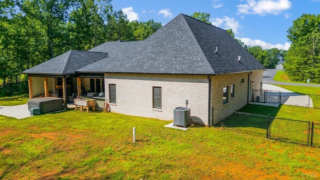 336 Somerset Dr, Appomattox, VA 24522 - rear view of house with a gate, a fenced backyard, a shingled roof, and brick siding