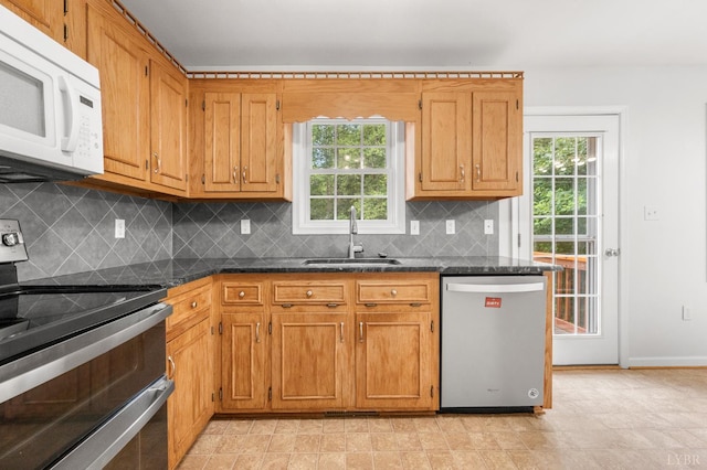 1279 Buck Creek Rd, Appomattox, VA 24522 - kitchen featuring stainless steel appliances, dark countertops, healthy amount of natural light, and decorative backsplash