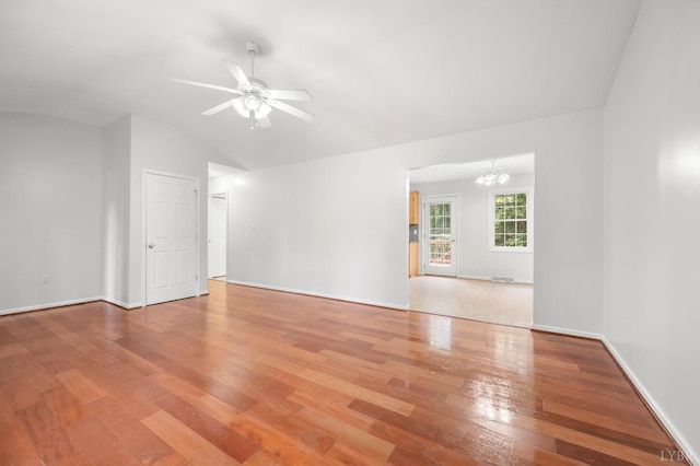 1279 Buck Creek Rd, Appomattox, VA 24522 - unfurnished room with light wood-type flooring, a chandelier, ceiling fan, and lofted ceiling