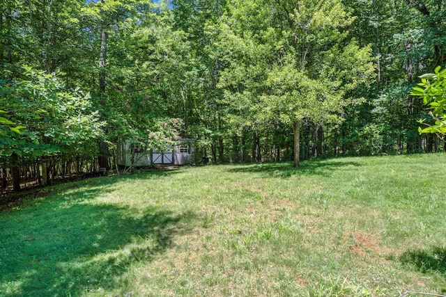 239 Briarcliff Ln, Madison Heights, VA 24572 - view of yard featuring a wooded view and an outdoor structure