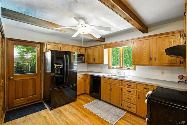 239 Briarcliff Ln, Madison Heights, VA 24572 - kitchen featuring black appliances, exhaust hood, plenty of natural light, beam ceiling, and light wood-type flooring