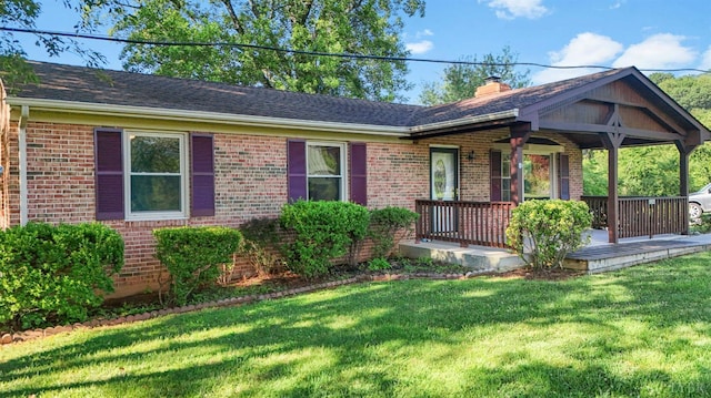 2294 High Peak Rd, Monroe, VA 24574 - single story home with brick siding, a chimney, a front lawn, and a porch