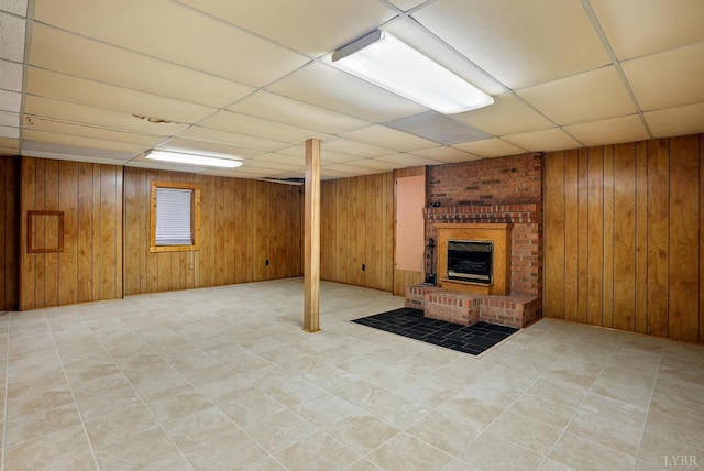 2294 High Peak Rd, Monroe, VA 24574 - finished below grade area featuring a paneled ceiling, wood walls, tile patterned floors, and a brick fireplace