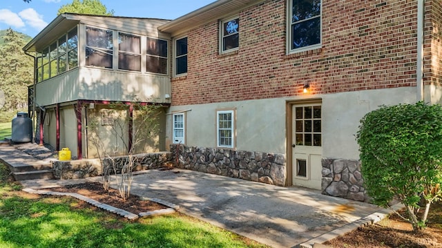 2294 High Peak Rd, Monroe, VA 24574 - rear view of house with a patio, stucco siding, brick siding, and stone siding