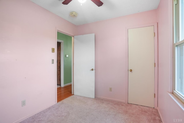 2294 High Peak Rd, Monroe, VA 24574 - unfurnished bedroom featuring carpet and a ceiling fan