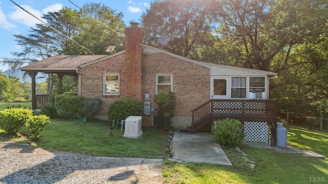 2294 High Peak Rd, Monroe, VA 24574 - view of property exterior with a lawn, a chimney, brick siding, and a sunroom