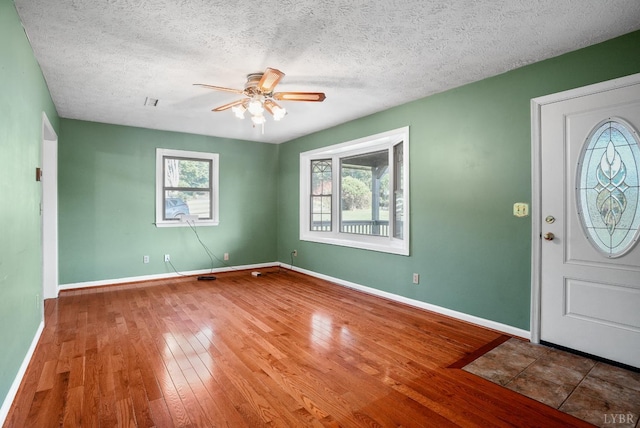 2294 High Peak Rd, Monroe, VA 24574 - entrance foyer with ceiling fan, wood finished floors, and a textured ceiling