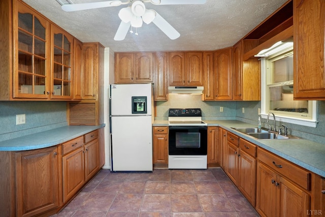 2294 High Peak Rd, Monroe, VA 24574 - kitchen featuring freestanding refrigerator, electric stove, under cabinet range hood, glass insert cabinets, and brown cabinetry