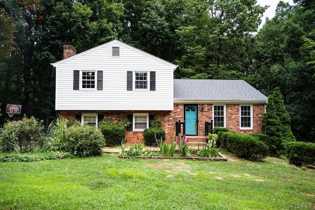 68 Cardwell Ln, Lynchburg, VA 24504 - split level home with a chimney, a front lawn, brick siding, and roof with shingles