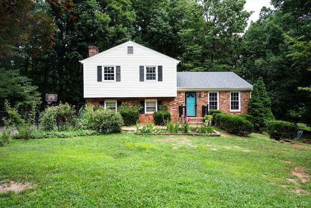 68 Cardwell Ln, Lynchburg, VA 24504 - tri-level home featuring a chimney, brick siding, a front lawn, and roof with shingles