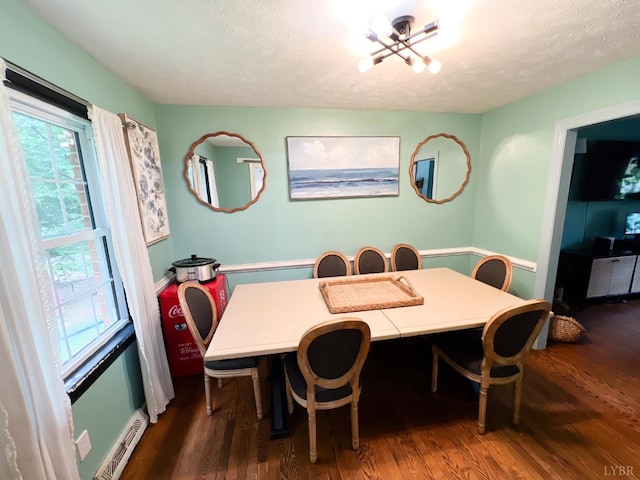 68 Cardwell Ln, Lynchburg, VA 24504 - dining room with wood finished floors, a chandelier, and a textured ceiling