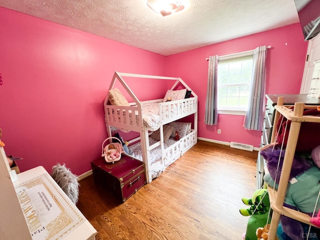 68 Cardwell Ln, Lynchburg, VA 24504 - bedroom featuring wood finished floors and a textured ceiling