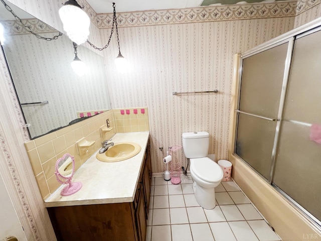 68 Cardwell Ln, Lynchburg, VA 24504 - bathroom featuring vanity, tile patterned floors, enclosed tub / shower combo, and wallpapered walls