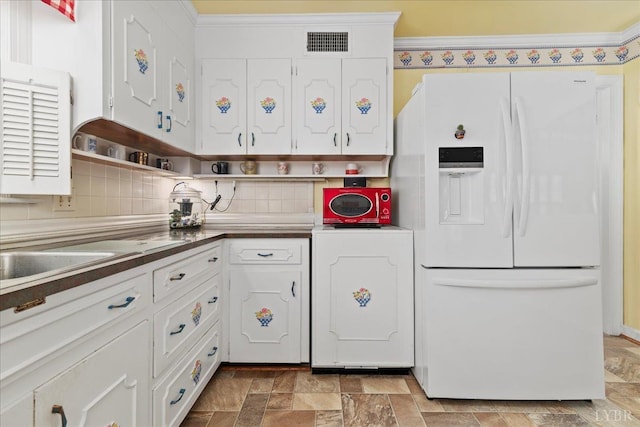 126 Arrowhead, Lynchburg, VA 24502 - kitchen featuring white fridge with ice dispenser, stone finish flooring, white cabinetry, decorative backsplash, and ornamental molding