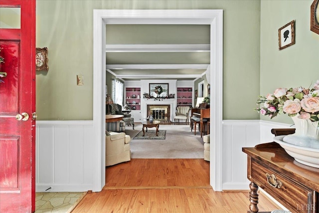 126 Arrowhead, Lynchburg, VA 24502 - corridor with built in features, wood finished floors, a decorative wall, and wainscoting
