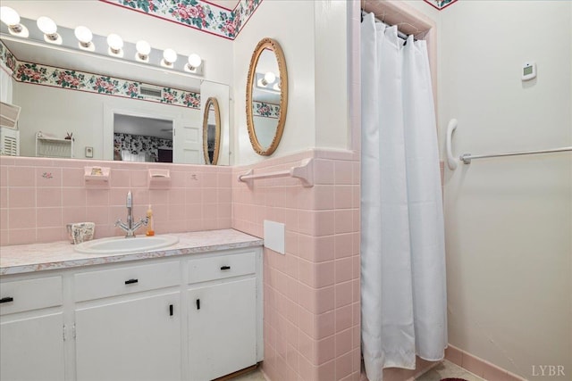 126 Arrowhead, Lynchburg, VA 24502 - full bath featuring tile walls, vanity, a shower with shower curtain, and wainscoting