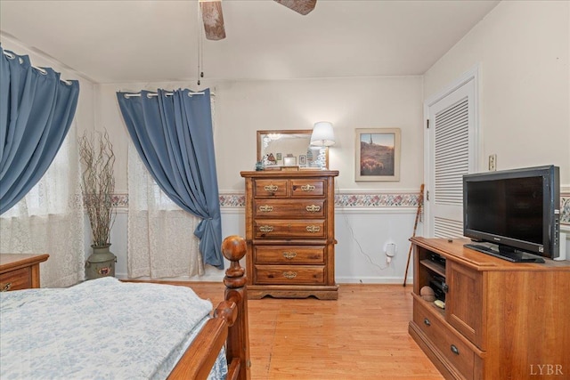 126 Arrowhead, Lynchburg, VA 24502 - bedroom featuring light wood-style floors, a ceiling fan, wainscoting, and a closet