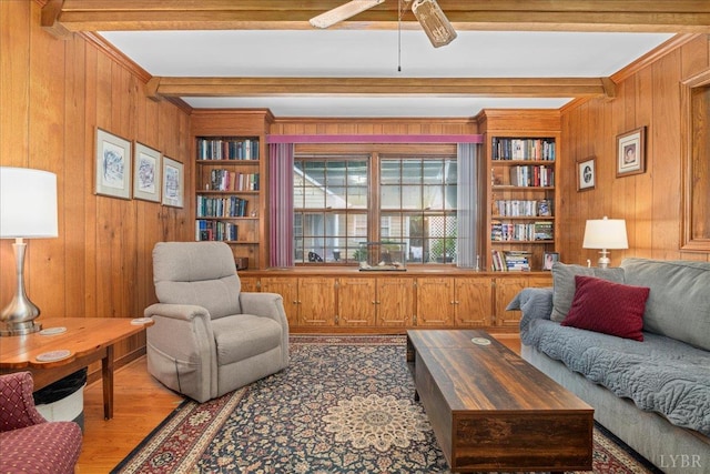 126 Arrowhead, Lynchburg, VA 24502 - living room with wooden walls, beam ceiling, wood finished floors, a ceiling fan, and built in shelves