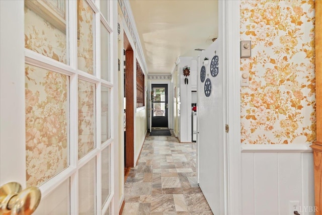 126 Arrowhead, Lynchburg, VA 24502 - hallway with wallpapered walls, a wainscoted wall, and light stone finish flooring