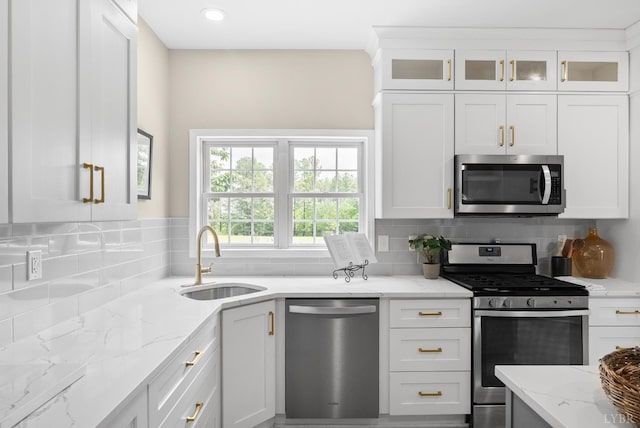 1505 Chestnut Grove Rd, Appomattox, VA 24522 - kitchen with appliances with stainless steel finishes, backsplash, white cabinets, light stone countertops, and glass insert cabinets