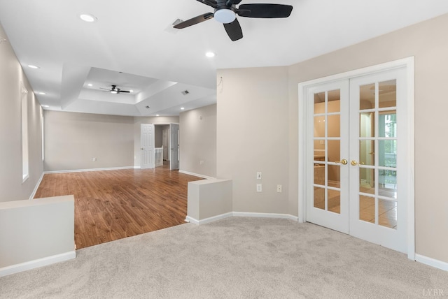 1505 Chestnut Grove Rd, Appomattox, VA 24522 - carpeted empty room with french doors, ceiling fan, a raised ceiling, recessed lighting, and wood finished floors