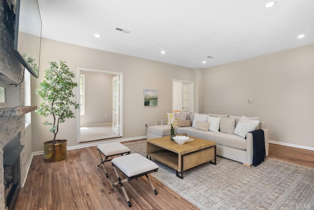 1505 Chestnut Grove Rd, Appomattox, VA 24522 - living room with wood finished floors, a fireplace, and recessed lighting