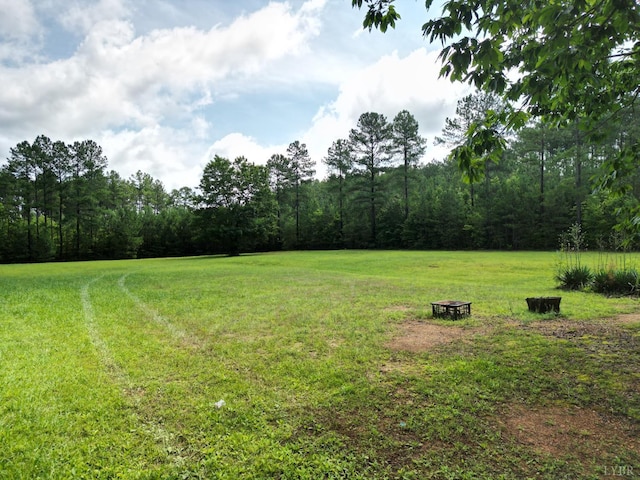 1505 Chestnut Grove Rd, Appomattox, VA 24522 - view of green lawn featuring a wooded view