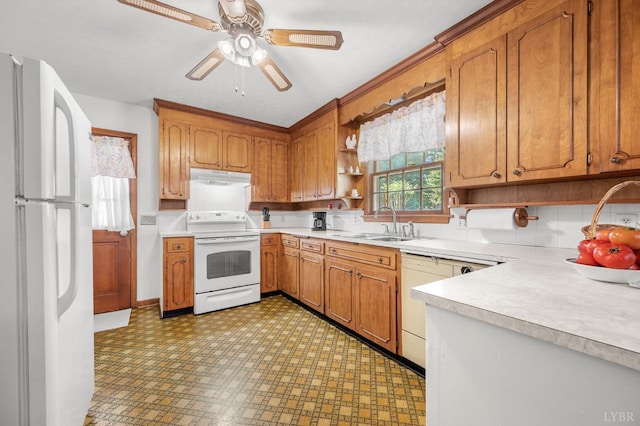 201 Windsor Rd, Lynchburg, VA 24502 - kitchen with white appliances, under cabinet range hood, light floors, light countertops, and brown cabinets