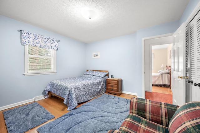 201 Windsor Rd, Lynchburg, VA 24502 - bedroom with a textured ceiling, wood finished floors, and a closet