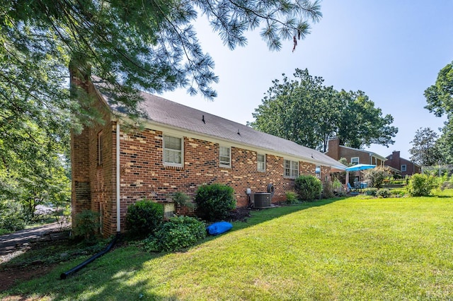 201 Windsor Rd, Lynchburg, VA 24502 - back of house featuring brick siding, a lawn, and a chimney