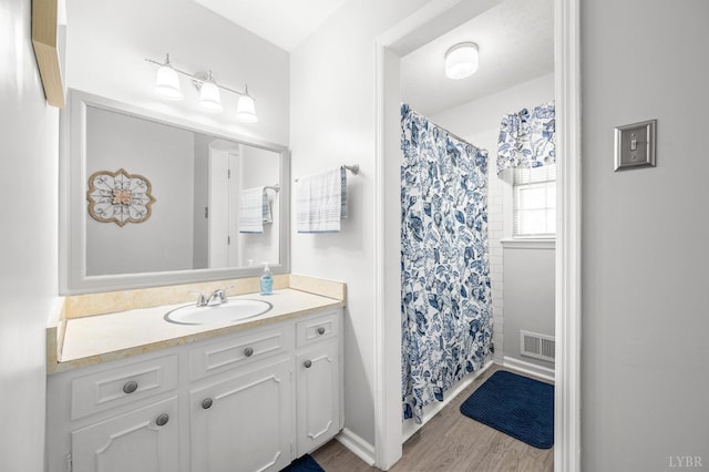 201 Windsor Rd, Lynchburg, VA 24502 - bathroom featuring vanity, wood finished floors, and a shower with curtain