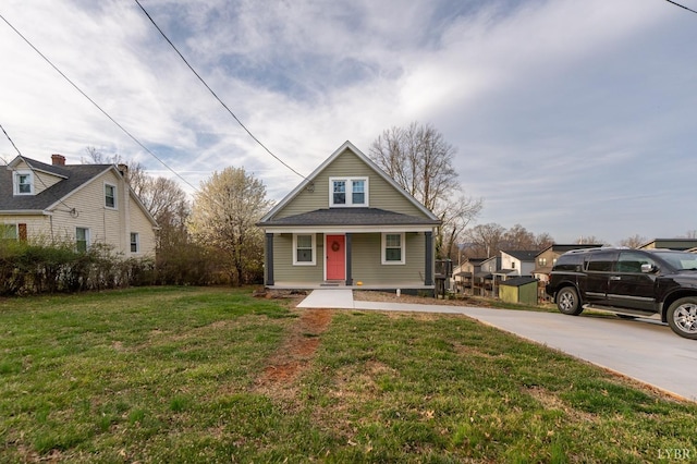 3040 Forest Hills Cir, Lynchburg, VA 24501 - bungalow-style home with covered porch, a front yard, and concrete driveway