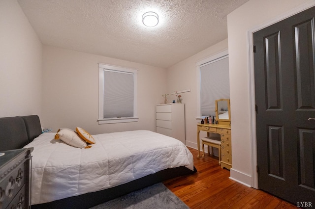 3040 Forest Hills Cir, Lynchburg, VA 24501 - bedroom featuring wood finished floors and a textured ceiling