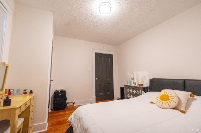 3040 Forest Hills Cir, Lynchburg, VA 24501 - bedroom with wood finished floors and a textured ceiling