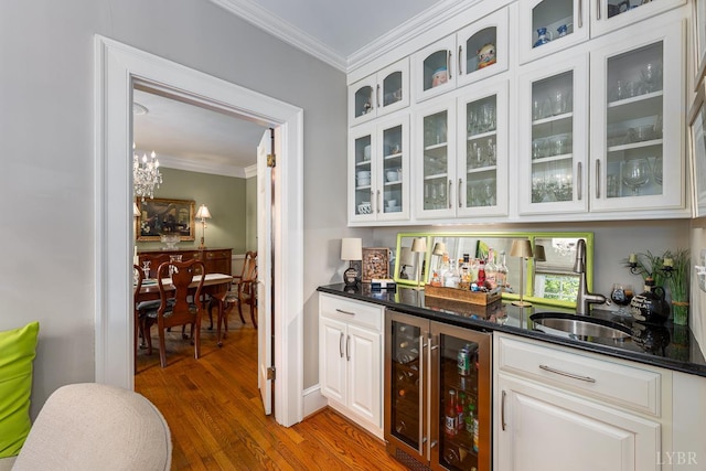 1517 Linden Ave, Lynchburg, VA 24503 - indoor bar with wine cooler, ornamental molding, and wood finished floors