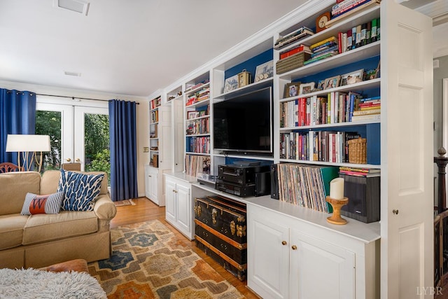 1517 Linden Ave, Lynchburg, VA 24503 - living room featuring light wood-type flooring, french doors, and crown molding