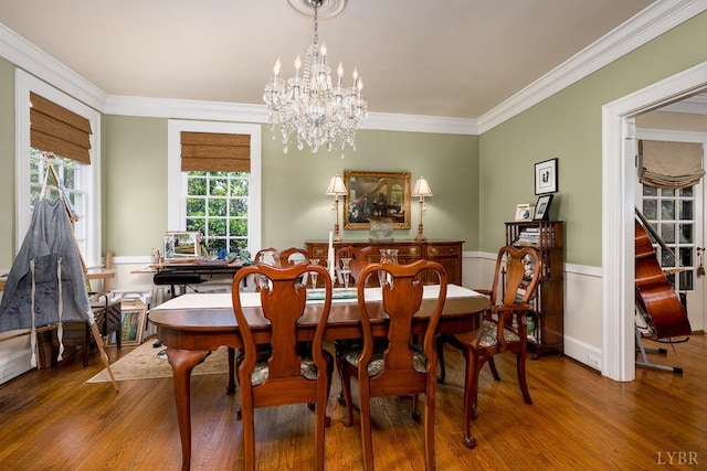 1517 Linden Ave, Lynchburg, VA 24503 - dining area featuring a chandelier, wood finished floors, crown molding, and wainscoting