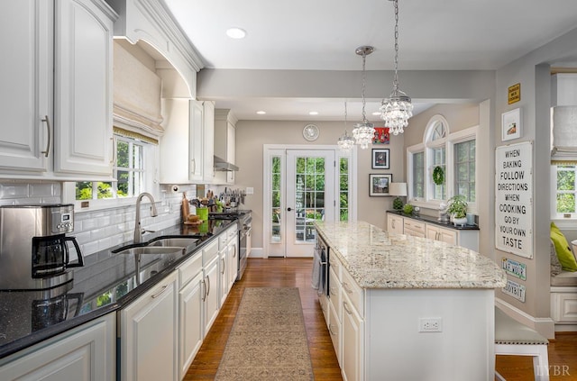 1517 Linden Ave, Lynchburg, VA 24503 - kitchen with a kitchen island, plenty of natural light, tasteful backsplash, and recessed lighting