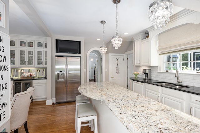1517 Linden Ave, Lynchburg, VA 24503 - kitchen with stainless steel built in refrigerator, decorative backsplash, recessed lighting, white cabinets, and wood finished floors