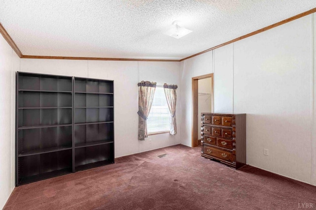 7026 Midway Rd, Phenix, VA 23959 - unfurnished bedroom featuring crown molding, a textured ceiling, and carpet floors