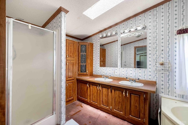 7026 Midway Rd, Phenix, VA 23959 - bathroom featuring wallpapered walls, crown molding, a shower stall, a textured ceiling, and double vanity