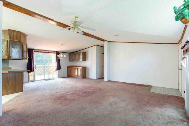 7026 Midway Rd, Phenix, VA 23959 - unfurnished living room featuring lofted ceiling, light colored carpet, ceiling fan, a textured ceiling, and ornamental molding